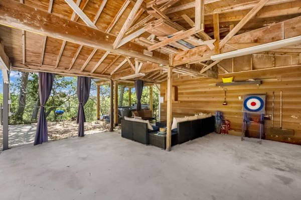 Carport hangout with axe dartboard